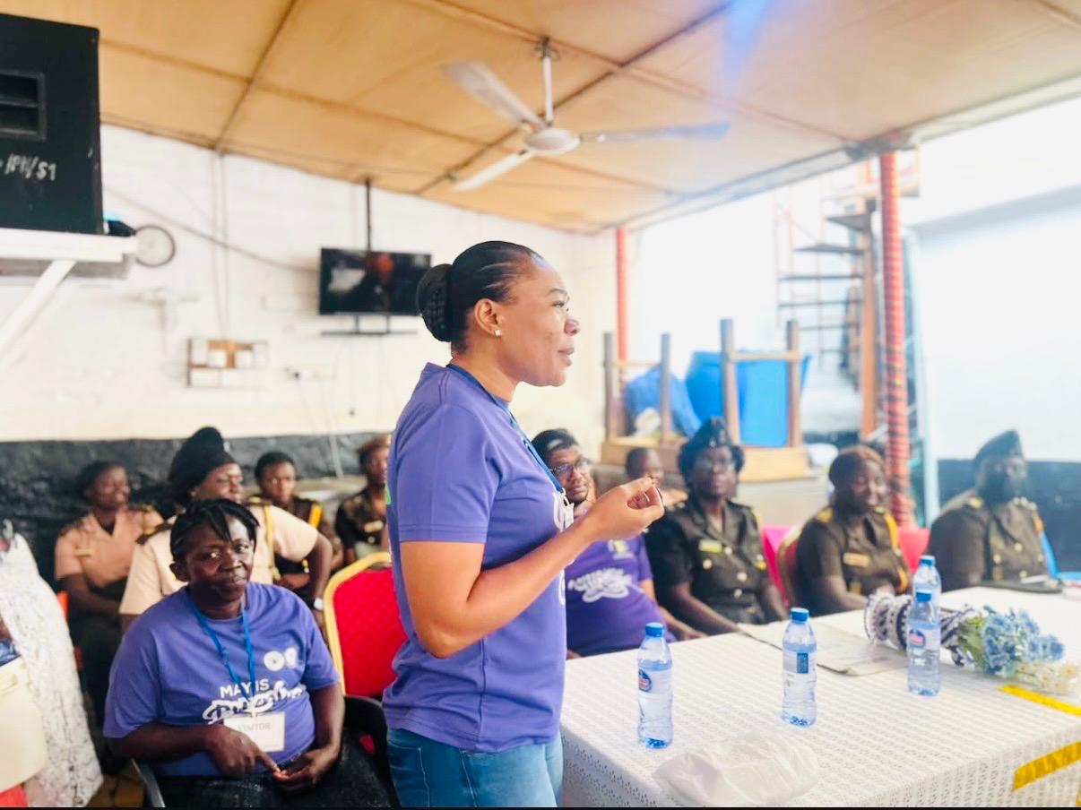 Dr. Modesta Abbem addressing women at a community event